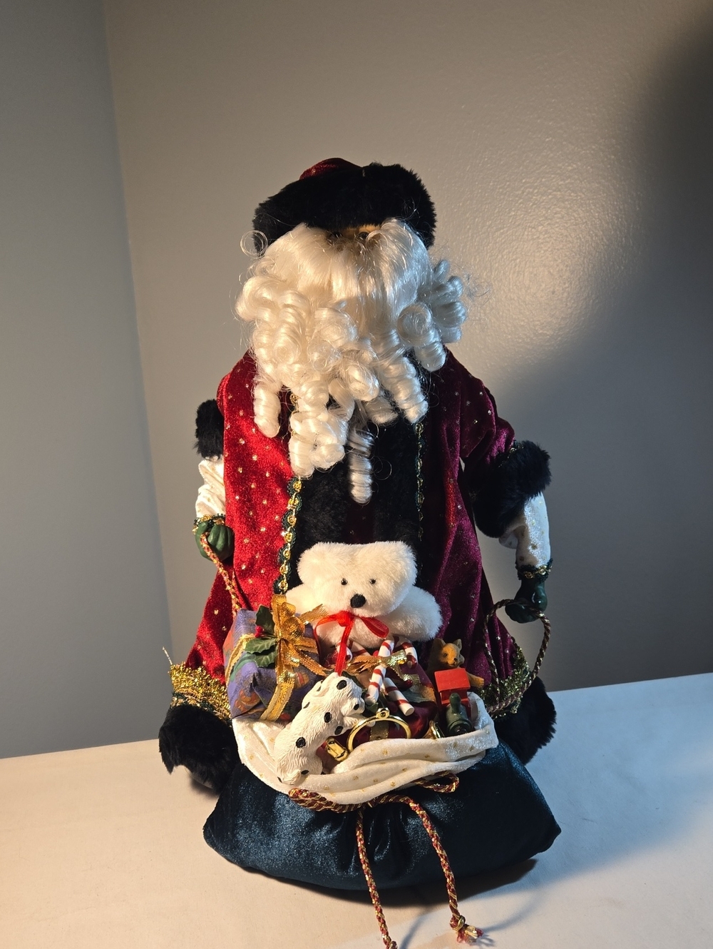 Velvet Santa Claus Holiday Figurine with Teddy and Gifts - Red, White, Black